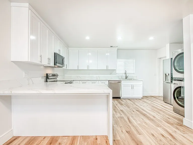 Luxury Kitchen & Appliances, LVP Flooring, Quartz Countertops, Central Heating & Cooling, New Windows.
