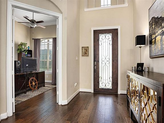Upon entering, you immediately notice the stunning flooring that flows throughout this home. The upgraded Buffalo Forge Steel do