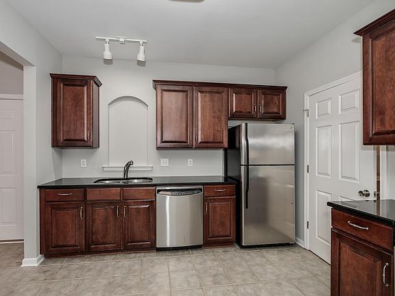 Large kitchen with gleaming wood cabinets