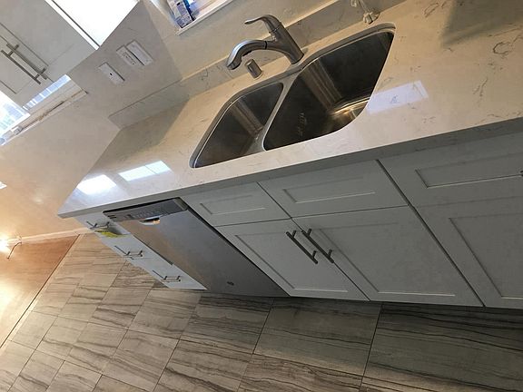 New kitchen counters, sink, faucet, cabinets and dishwasher