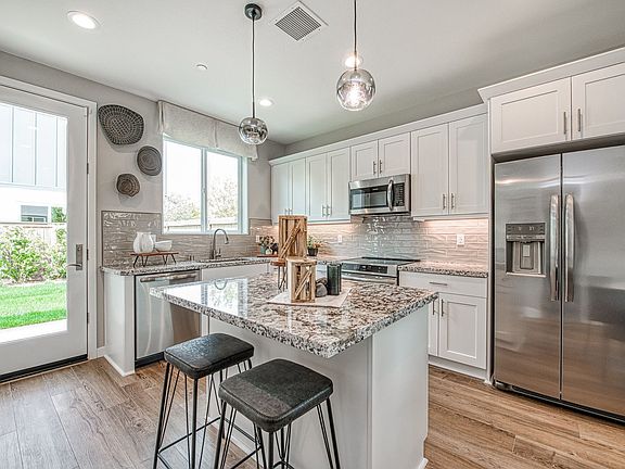 Kitchen provides stainless steel appliances an opportunity for beautiful Island with seating
