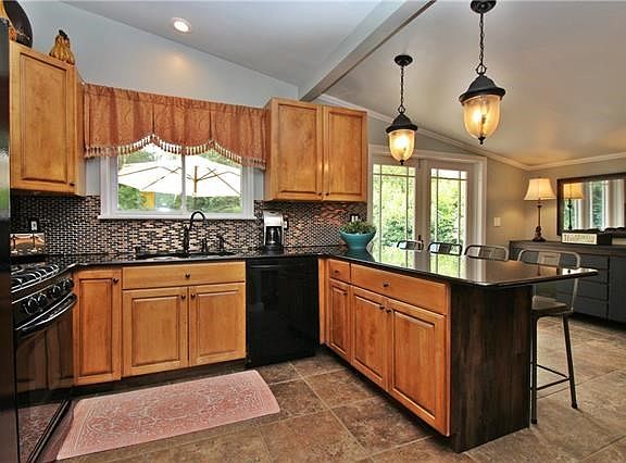 The expanded counter makes great work space or comfortable seating for five.