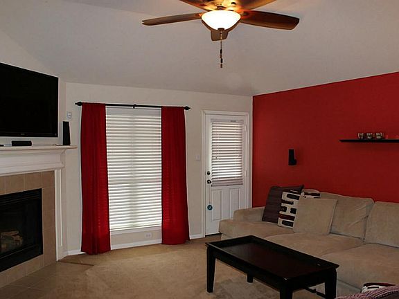 Entry leads to a cozy living space including gas log fireplace to keep you warm on chilly nights