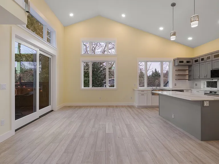 Kitchen, living area and sliding door to private yard.