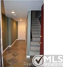 Entry way to condo / garage / laundry room / upper level