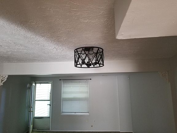 dining/living room area with light fixture. Updated colors.