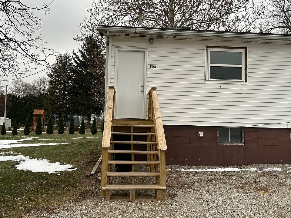 BACK ENTRANCE WITH OFF STREET PARKING.