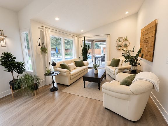 Inviting sitting area with access to a covered outdoor patio.