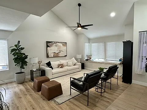 Living room next to the front door. Vinyl floors. Tile at the front door.