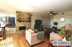 Spacious main floor living area with gorgeous slate fireplace & bamboo floors