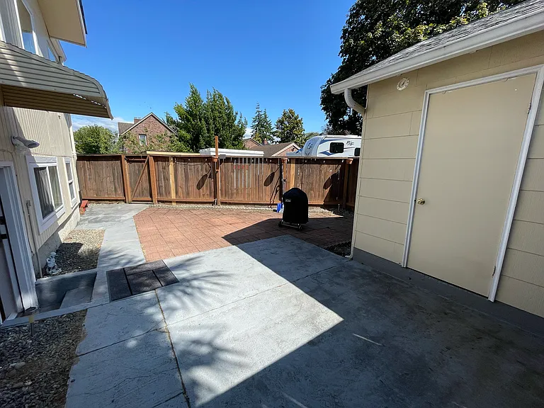 Entrance to lower level unit and partio to the right.