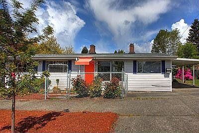 The brick wall to the left in this photo is the back of the fireplace, which could be opened up for 