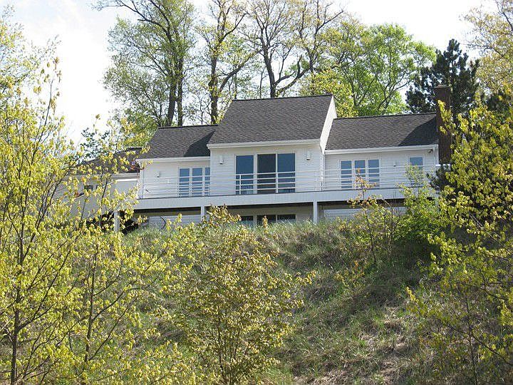 Nestled atop the sand dunes with fabulous Lake Michigan views