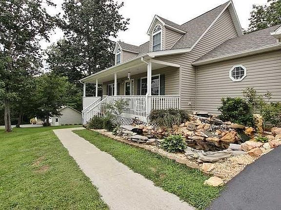 Front of home with pond