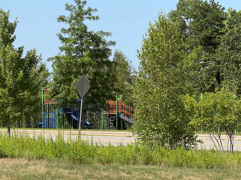 Kids park nearby as seen from side walk opposite home.