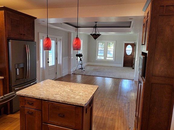 View from Kitchen looking into Dining Room and Living Room.