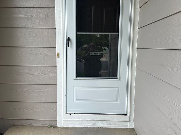 Entrance with new storm door.