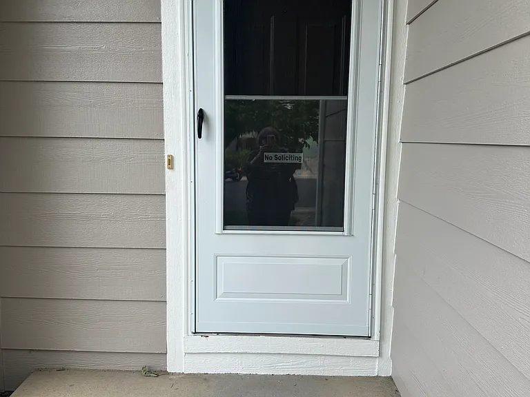 Entrance with new storm door.