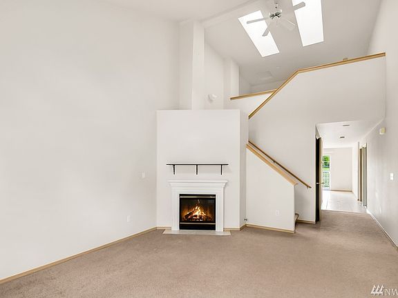 Great living room with fireplace and high ceiling