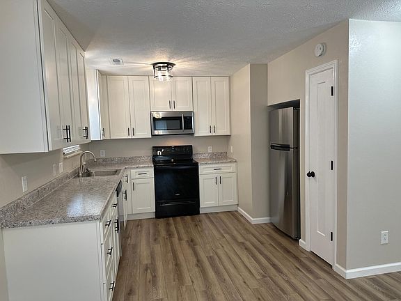 Kitchen. Solid white shaker cabinets. high end appliances