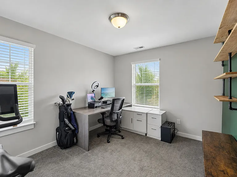 Versatile third bedroom perfect for a home office, nursery, or guest room.