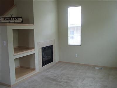 Living room with nice fireplace, and built in media area