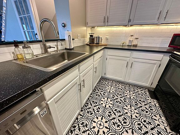 Modern tile and updated appliances are the crown jewels of the kitchen!