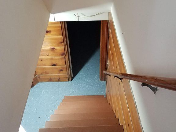 Stairway to downstairs where Bedroom 4, half-bath, rec room and laundry/work room is.