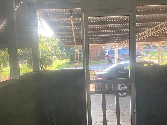 Screened in porch and 2 car covered car port.