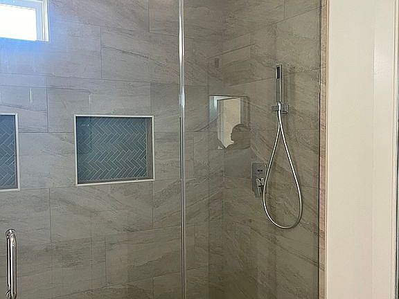 Waterfall shower w/seating.
