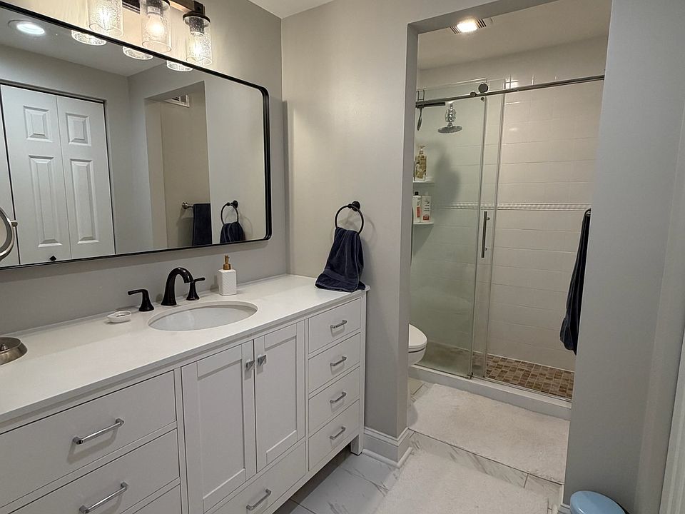 Primary bathroom accessible from the primary bedroom, featuring a spacious layout and premium bidet.