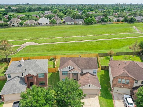 An aerial view of the front of the home shows NO BACK DOOR NEIGHBORS! The home is 2,258 square feet!