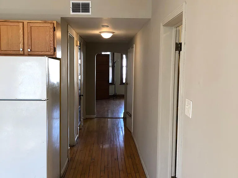 2 larger bedrooms on one side of hallway, and smaller bedroom on the side near the bathroom.