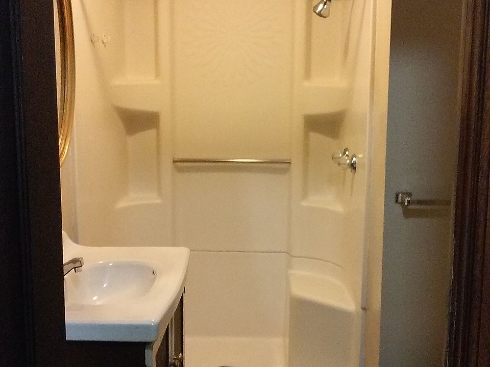 Small bathroom, notice the hard wood flooring.