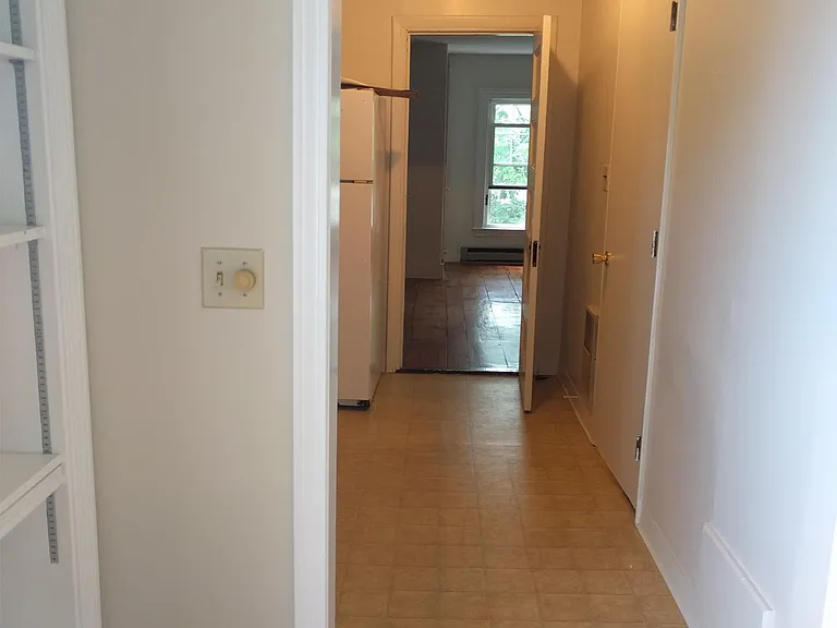 view from living room, through kitchen to bedroom
