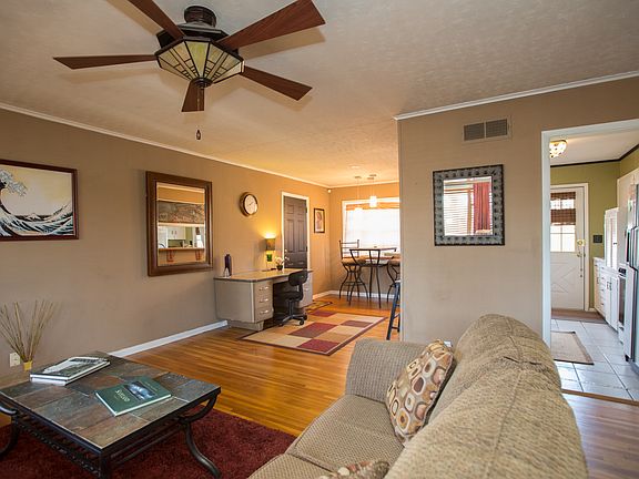 Spacious living room opens to dining area