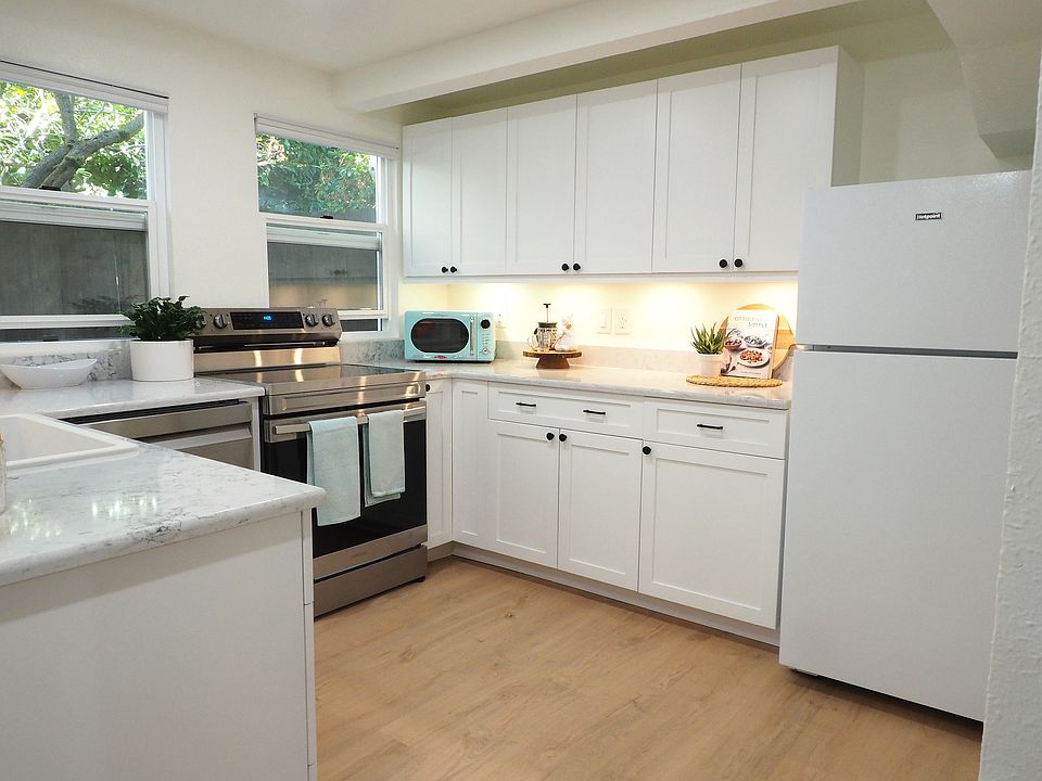 Modern kitchen with brand new appliances, quartz sink, and quartz countertops