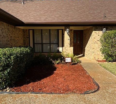 Front flower beds and front porch.
