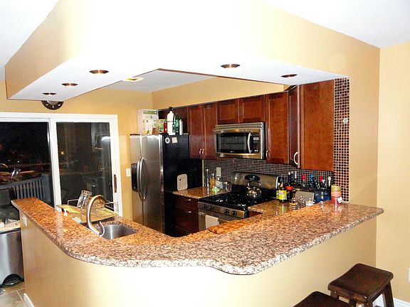 Kitchen w/ granite, cherry cabinets, SS appliances