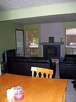 This is the front room.  You can see the fireplace and new carpet.