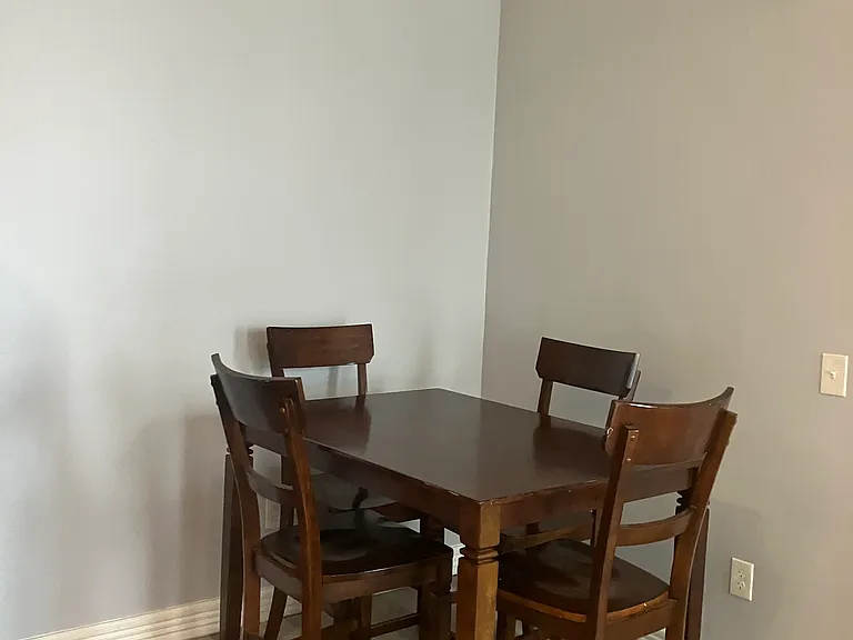 Dining area with a classic wooden table and chairs