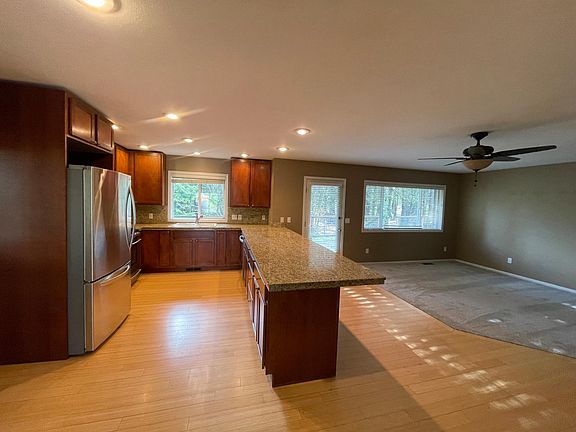 Kitchen and living room. Large granite peninsula seats 6. New appliances.