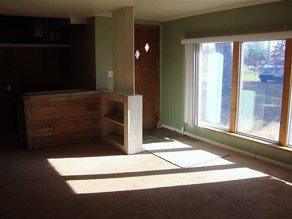 Living Room, Walls are newly painted white.