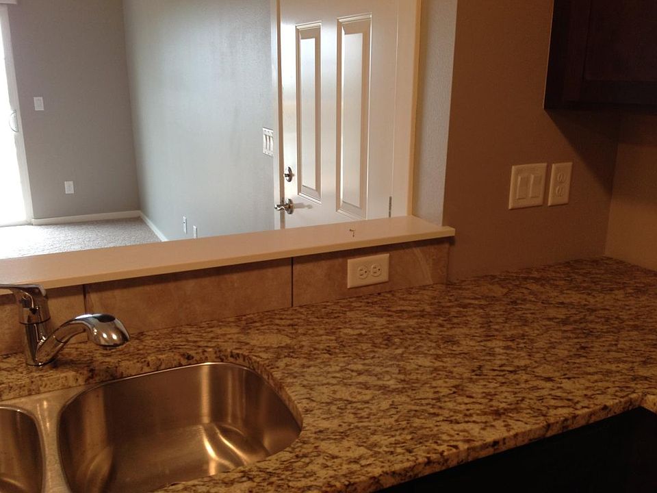 granite counter tops throughout bathrooms and kitchen