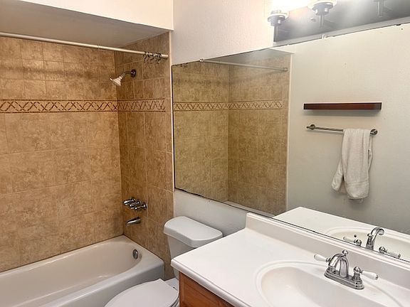 Guest bathroom with tub and shower