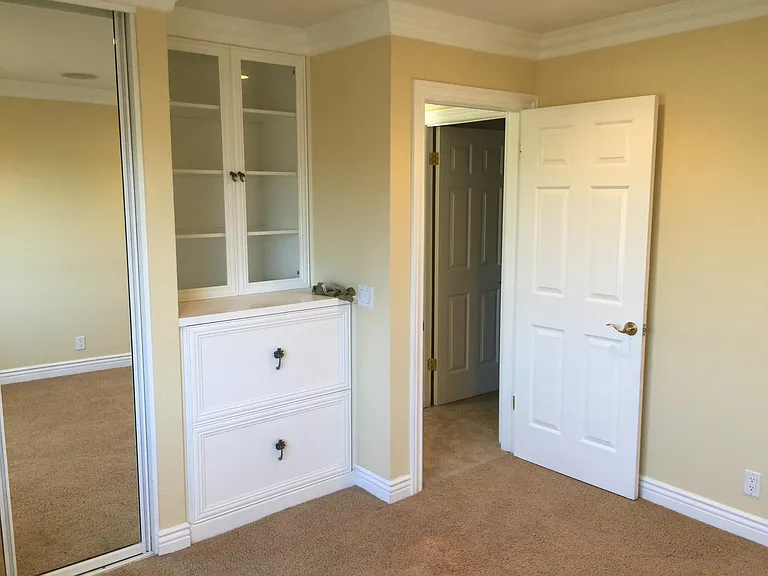 #4 bedroom with custom cabinets.