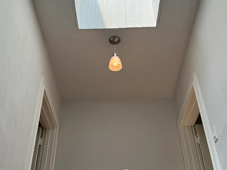 Skylight above center stairwell providing natural light to every area of the townhouse