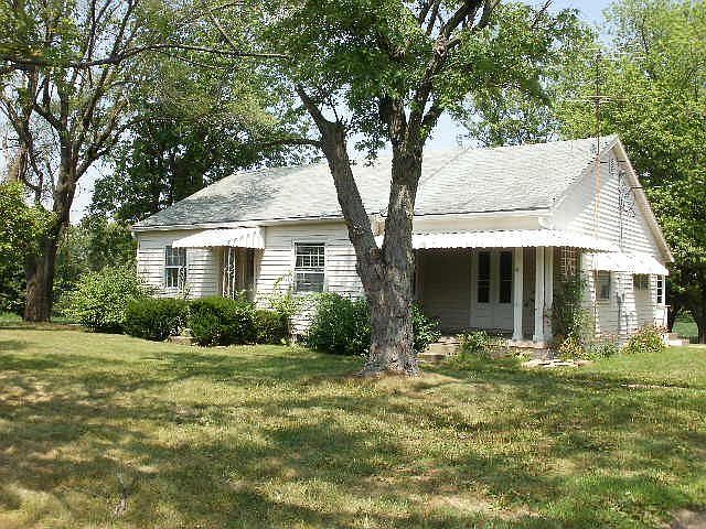 Classic Charm with Hardwood Floors, Arched Doorways & Covered Front Porch