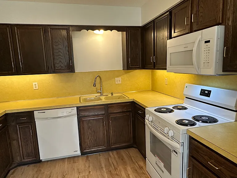 Colorful Bright Kitchen with New range oven. Built-in Micro above. New - LVT flooring.