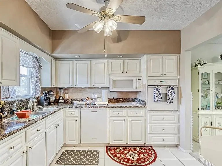 Kitchen comes with a refrigerator with ice maker, microwave, stove, oven, dish washer, plenty of cabinet space.